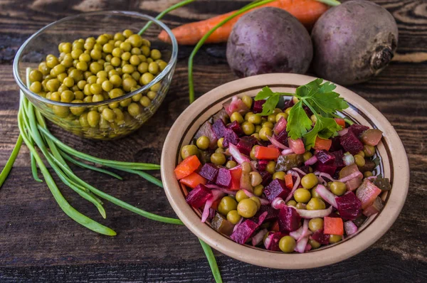 Salad Vinaigrette of beets on a wooden background. Top view — Stock Image Salad Vinaigrette of beets on a wooden background. Top view Royalty Free Stock Images
