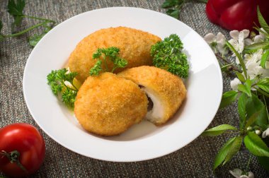 Chicken cutlets on Kiev. Old background. Top view. Close-up clipart
