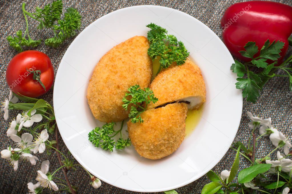 Chicken cutlets on Kiev. Old background. Top view. Close-up