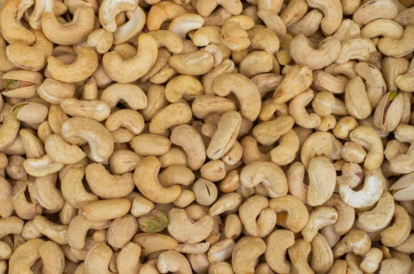 Cashewnötter rik på hjärtat vänliga fettsyror. Hälsosam mat. Cashewnötter som mat bakgrund. Ovanifrån. Närbild — Stockfoto