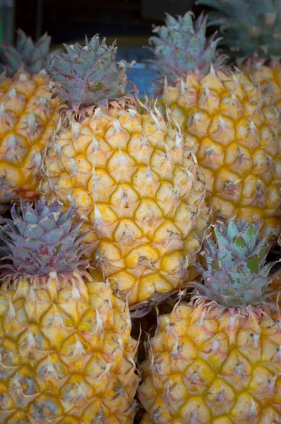 Fresh pineapples at fruit market. Top view. Close-up — Stock Photo, Image