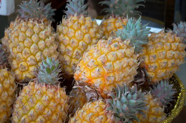 Fresh pineapples at fruit market. Top view. Close-up — Stock Photo, Image