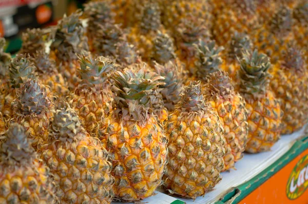 Fresh pineapples at fruit market. Top view. Close-up — Stock Photo, Image