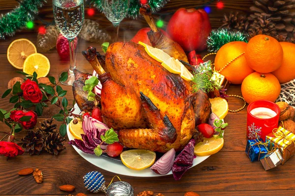 Christmas Dinner. Roasted chicken. Winter Holiday table served. Wooden background. Close-up. Top view