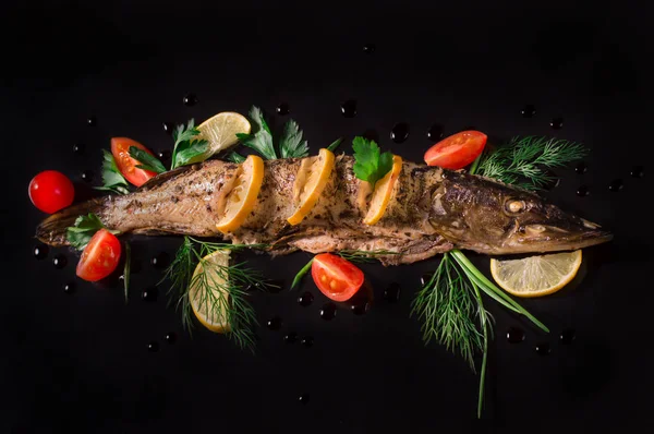 Cooked pike with tomato, lemon and dill. Black background. Top view. — Stock Image Cooked pike with tomato, lemon and dill. Black background. Top view. Stock Image