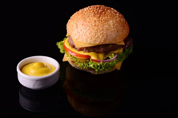 Fresh burger closeup. Black background. Top view — Stock Photo, Image