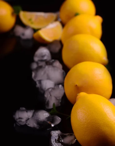 Lemons isolated on the black background. Top view
