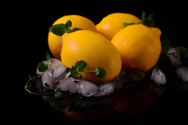 Lemons isolated on the black background. Top view — Stock Photo, Image