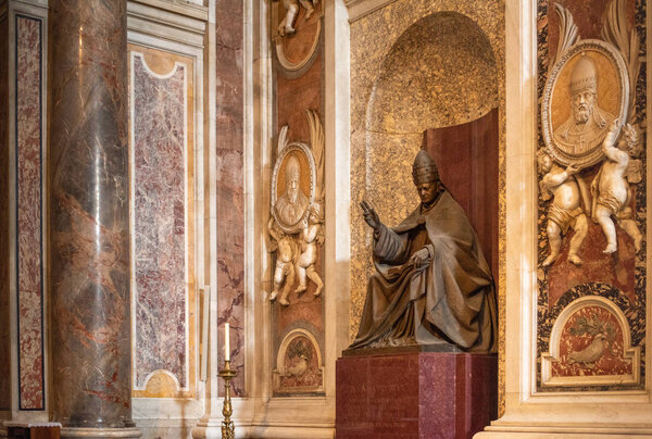 VATICAN - November 11, 2018: Inside the St. Peters Basilica, Rome, Italy. St Peters church San Pietro is one of the main landmarks in Rome. St Peters interior in sun rays.