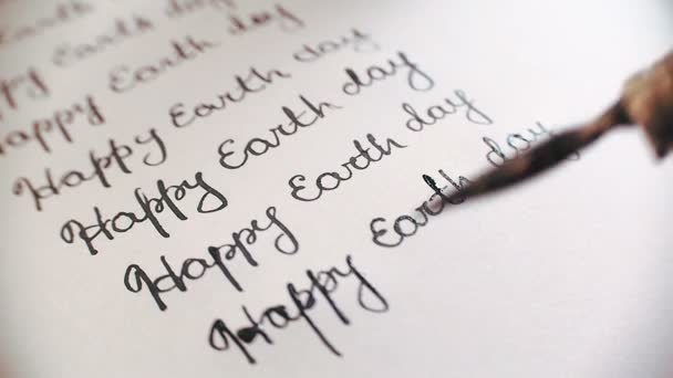 Happy earth day calligraphy and lattering. Ninth line. Close-up whith audio — Stock Video