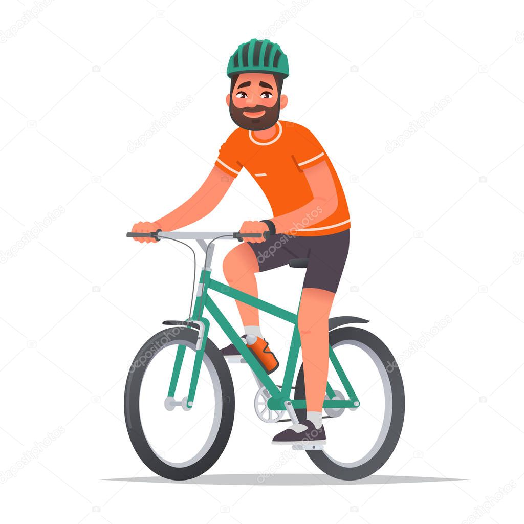 Happy man dressed in sportswear and a helmet rides a bicycle. Bi