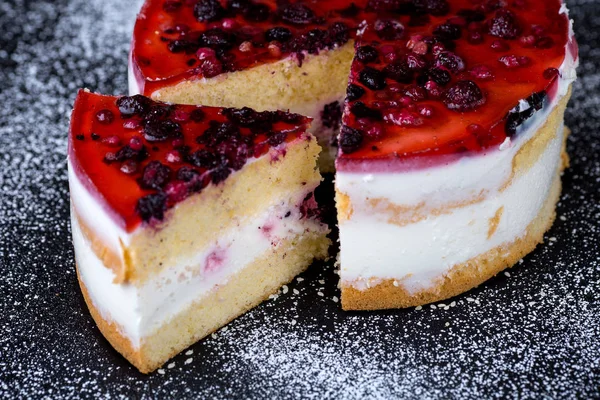 Homemade berry cream cake on black background — Stock Photo, Image