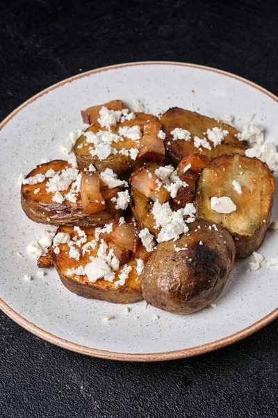 Slices Baked Potatoes Feta Cheese Bacon White Plate Dark Concrete — Stock Photo, Image