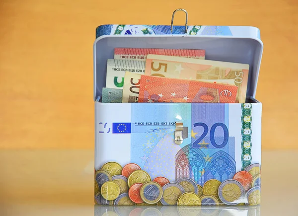 Saving money box with euro money