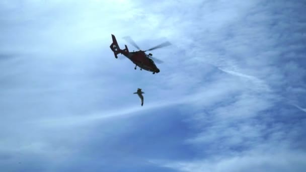 Helicopter flying against blue sky. Air transport aviation. Helicopter rescue. — Stock Video