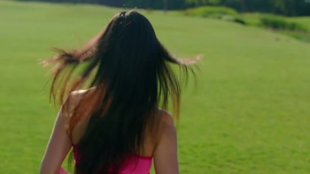 Long hair woman running in park. Back of running woman in slow motion — Stock Video