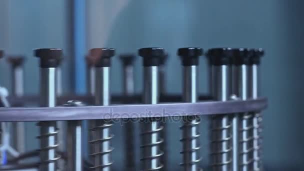 Industrial equipment. Circling metal sticks of machine. Part of production line — Stock Video