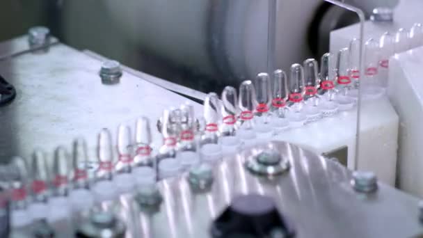 Medical vials on production line at pharmaceutical plant. Medical ampoules — Stock Video