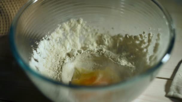 Bowl flour and chicken egg. Dough ingredients. Cooking ingredients — Stock Video