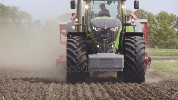 Tractor field. Agricultural tractor driving on arable field. Agricultural field