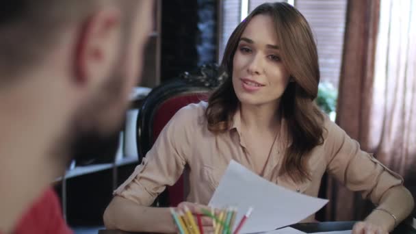 Portrait of female employee working in office. Smiling woman discussing work — Stock Video