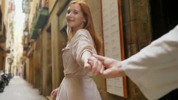 Closeup woman holding man hand in old city street. Pov of romantic couple hands — Stock Video