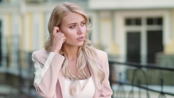 Portrait woman talking by wireless headset. Girl using wireless earbuds — Stock Video