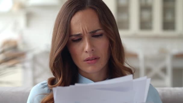 Sad business woman reading documents at home office. Girl working with diagrams. — Stock Video