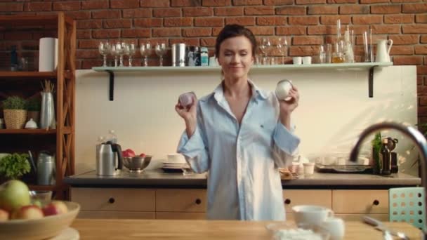 Woman preparing healthy breakfast. Girl putting two yogurt cups on wooden table. — 비디오