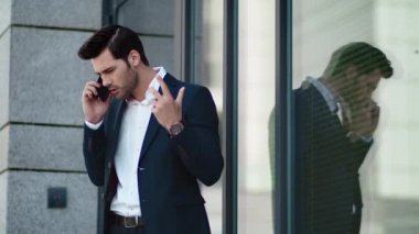 Closeup man discussing business at street. Businessman talking in stylish suit