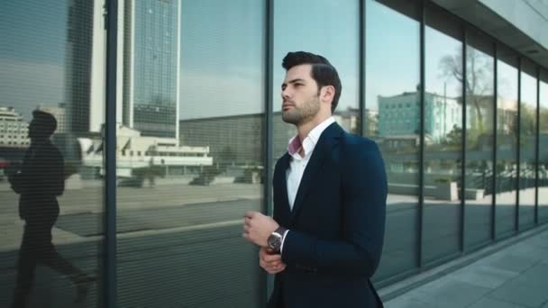 Portrait man checking time on watch. Businessman walking in suit at street — 图库视频影像