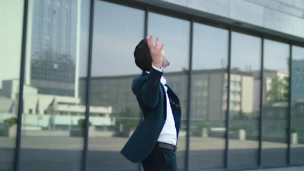 Closeup man raising hands at street. Businessman celebrating victory outdoor — Stock Video