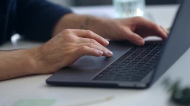 Close up man hands surfing internet on computer. Businessman hands typing laptop