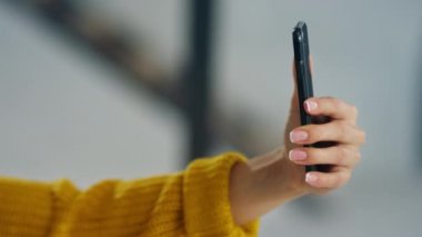 Closeup woman hands making selfie photo on mobile phone. Woman posing for selfie