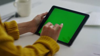 Close up businesswoman hands touching pad screen in slow motion.