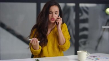 Close up upset businesswoman talking mobile phone. Sad girl calling on cellphone