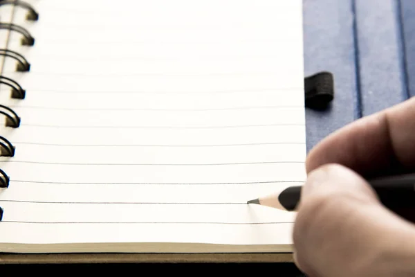 Lápis no caderno — Fotografia de Stock