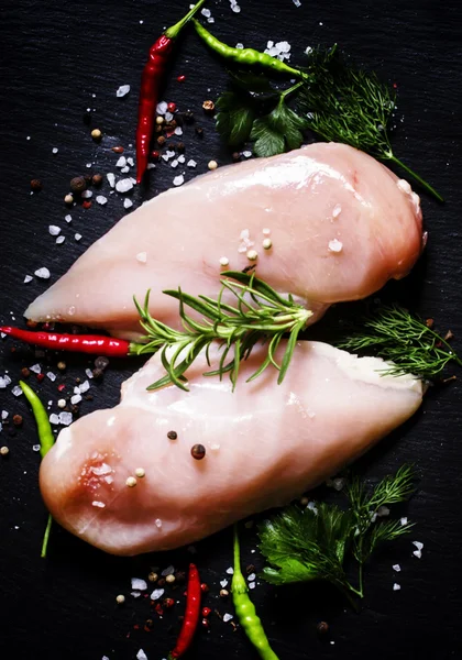 Raw chicken fillets with herbs and spices — Stock Photo, Image