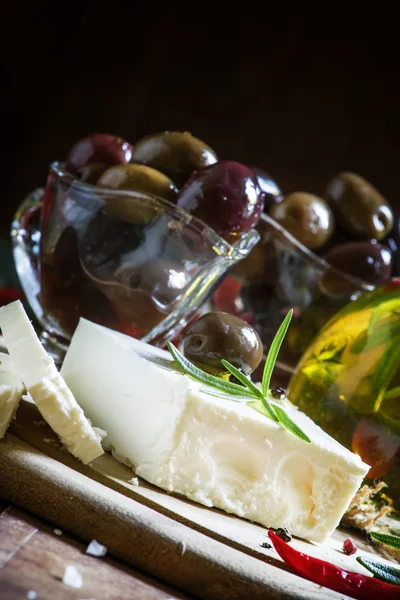 Soft greek feta cheese with rosemary, olives and butter — Stock Photo, Image