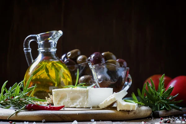 Soft greek feta cheese with rosemary, olives and butter — Stock Photo, Image