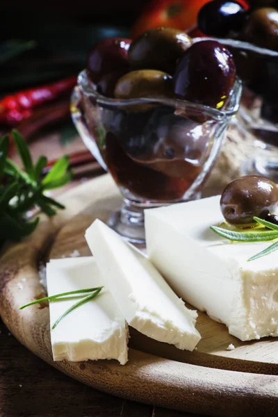Greek feta cheese, dark wood background — Stock Photo, Image
