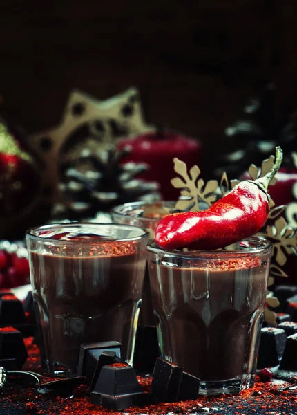 Liquid dark chocolate with spicy chili pepper — Stock Photo, Image