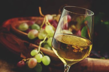 Autumn ice wine, ripe grapes and dried leaves clipart