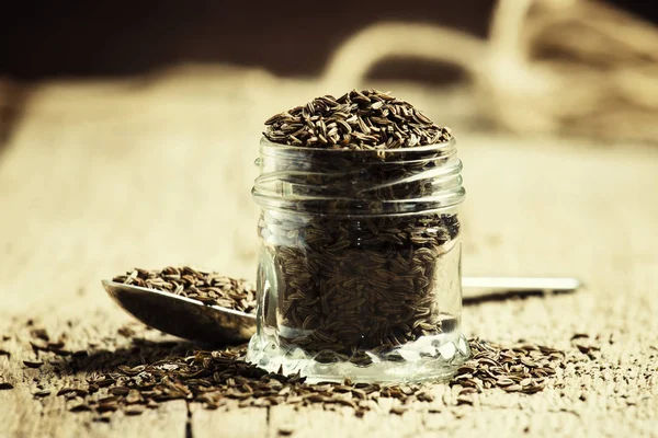 Semillas de alcaravea en un frasco de vidrio — Foto de Stock