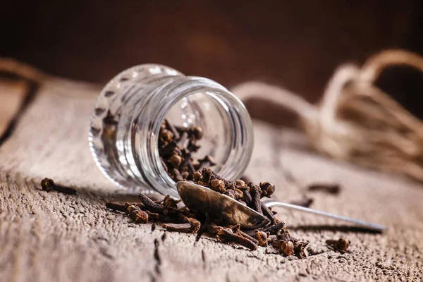 Cloves, old wooden background — Stock Photo, Image