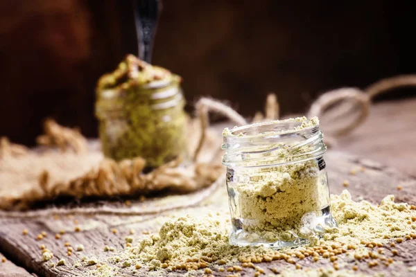 Mustard powder in a glass jars — Stock Photo, Image