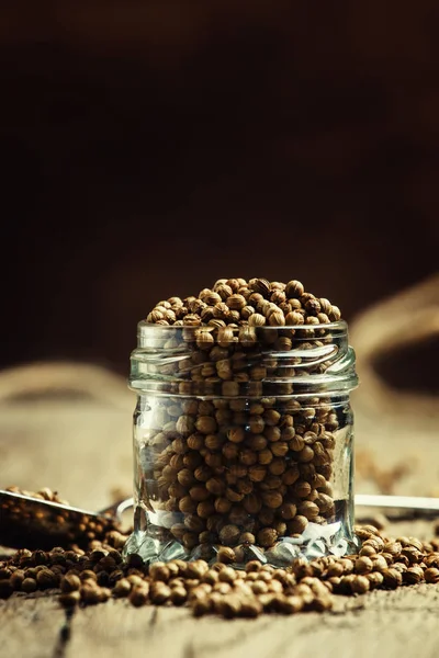 Coriander seeds in jar — Stock Photo, Image