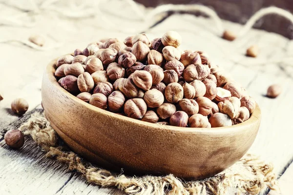 Peeled hazelnuts in a bowl, rustic style — Stock Photo, Image