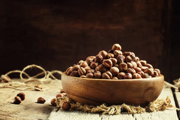 Peeled hazelnuts in a bowl, rustic style — Stock Photo, Image