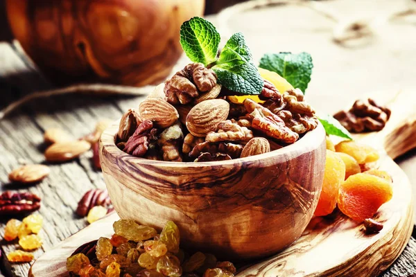 Healthy snacks in wooden bowl — Stock Photo, Image